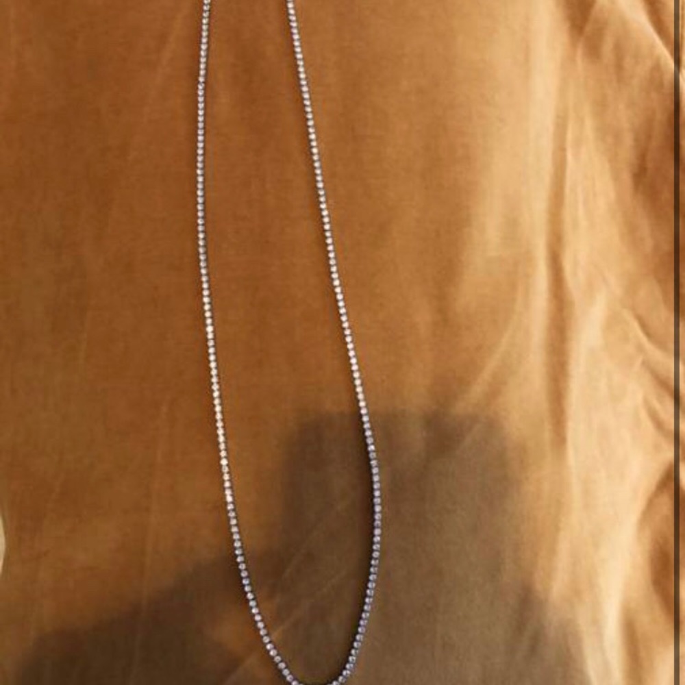 Men’s or women 2mm 24 in tennis necklace dipped in 14kt gold and sapphire.